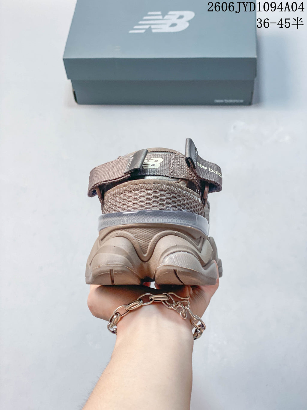 Rear view showing the heel pull tab and sculpted sole of the sneaker