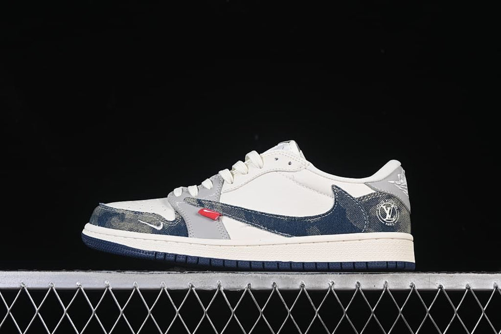 Side view of a white and grey low-top sneaker with dark blue patterned overlays and a dark outsole.