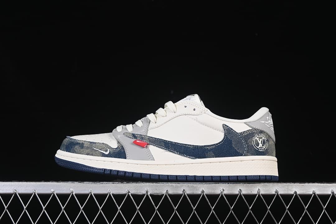 Side view of a white and grey low-top sneaker with dark blue patterned overlays and a dark outsole.