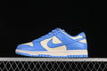Side view of blue and cream Nike Dunk Low sneakers