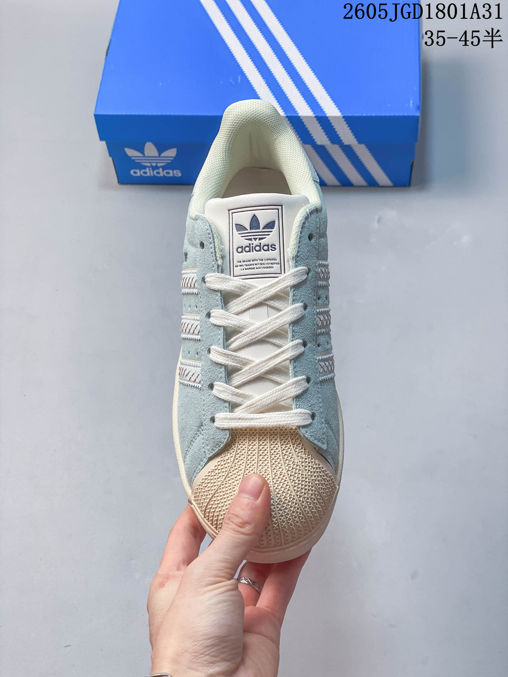 Front view showing the textured shell toe, laces, and tongue label