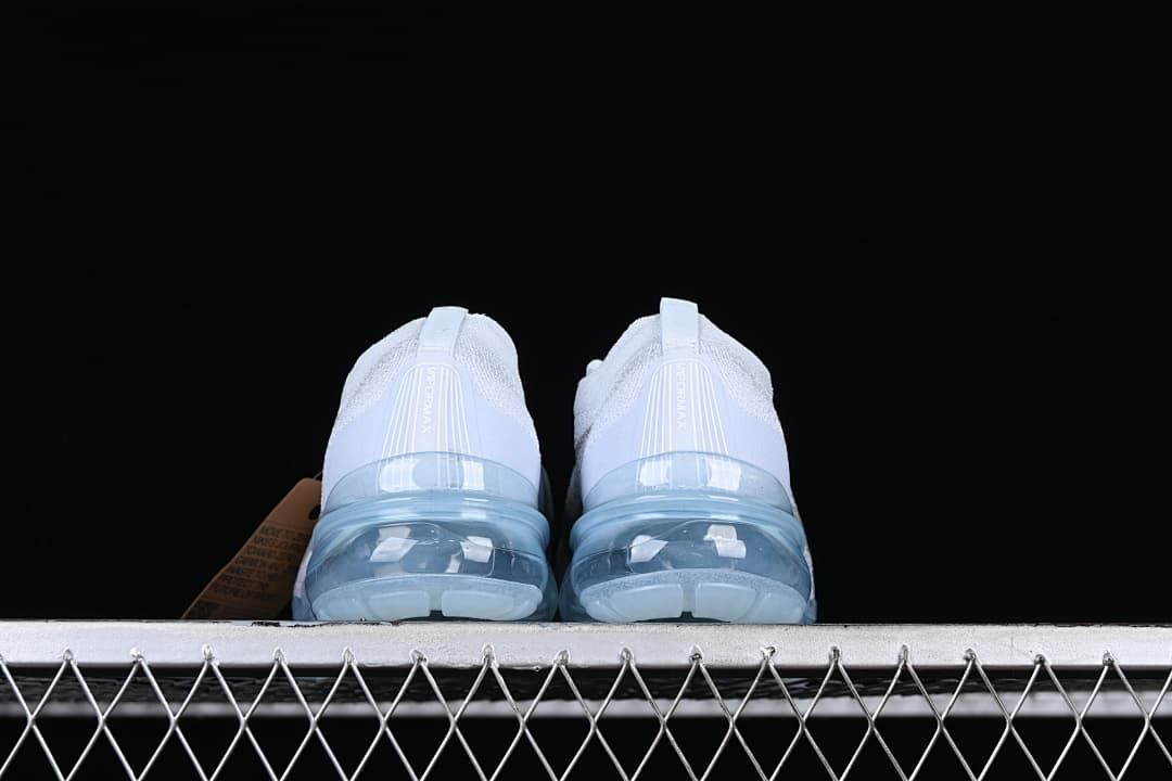 Rear view of the pair showing heel tabs and translucent blue soles