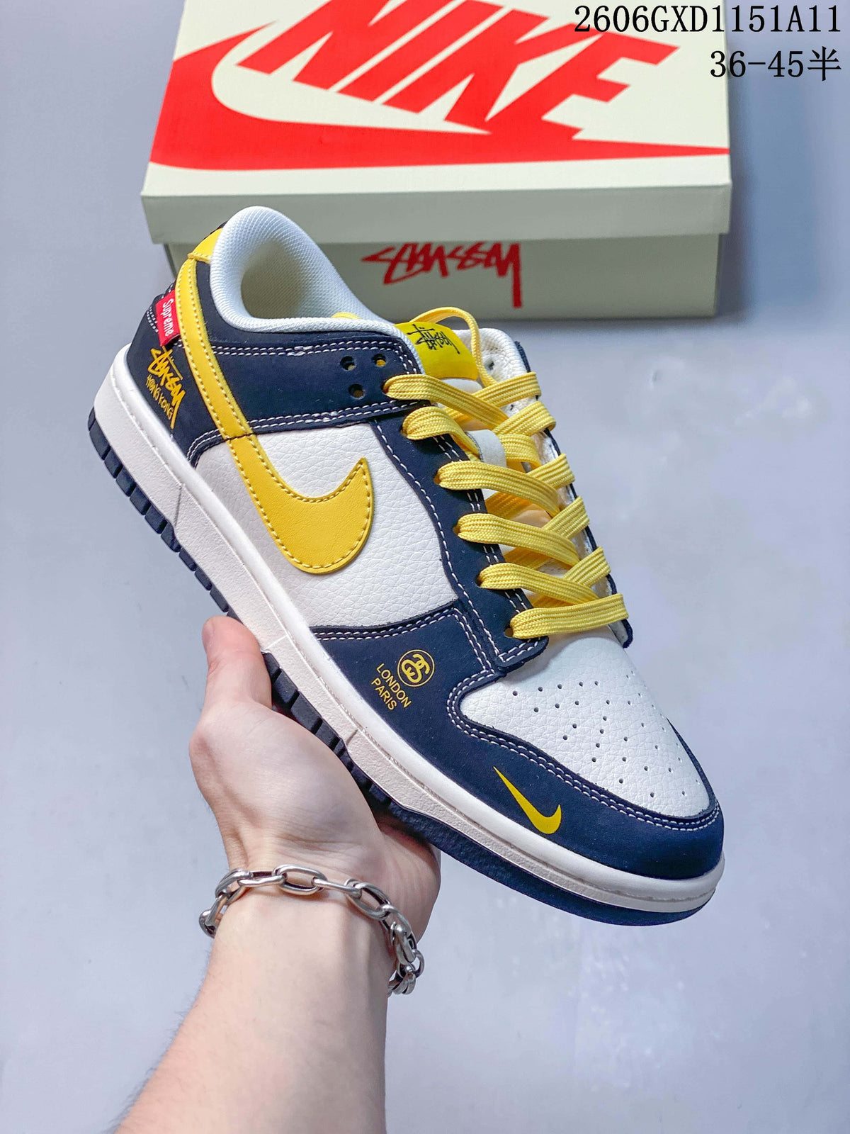 Angled side view highlighting the yellow Swoosh and graphic details