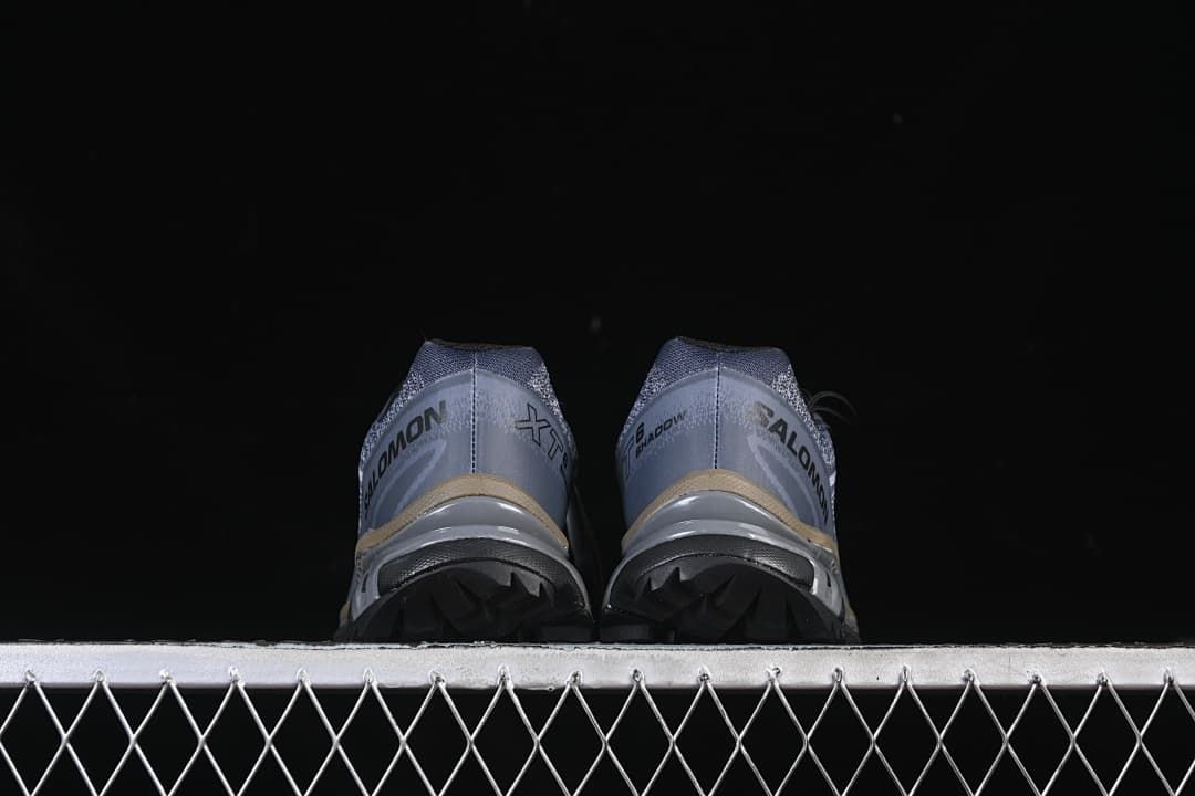Rear view of the pair showing heel details and outsole lugs