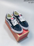 Pair of dark green Vans Old Skool sneakers with white laces and side stripes, shown on a Vans box.