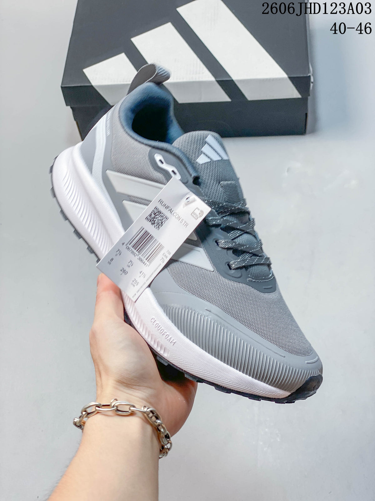 Angled view of a grey Adidas Runfalcon 5 TR shoe with a product tag