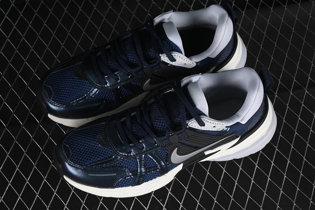 Pair of navy, black and white Nike V2K Run sneakers