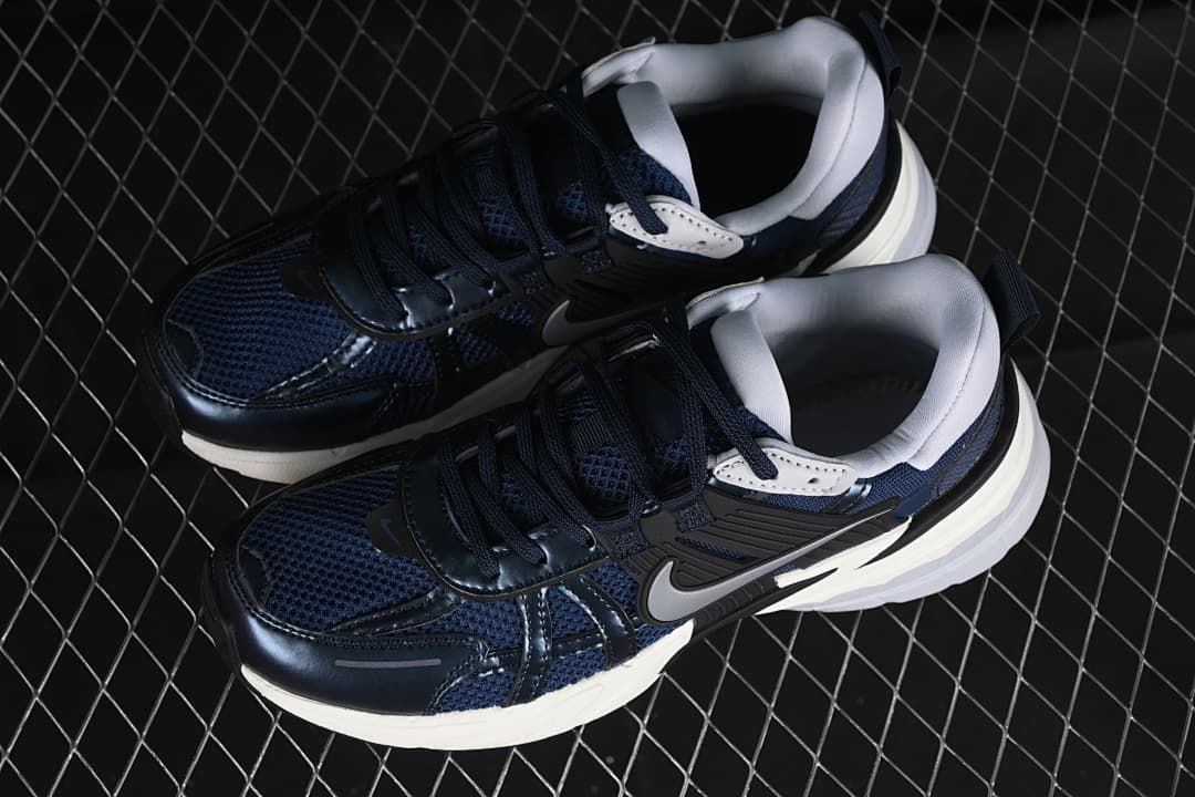 Pair of navy, black and white Nike V2K Run sneakers