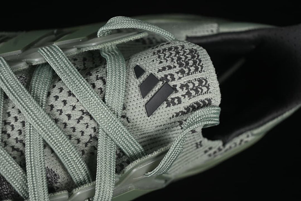 Close-up of the patterned tongue and laces with Adidas logo