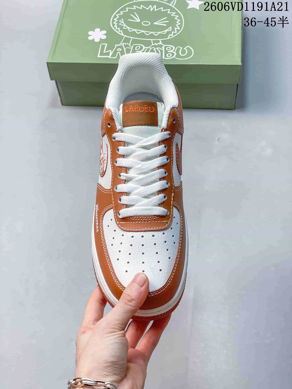 Top view showing the perforated toe, white laces, and LABUBU tongue detail
