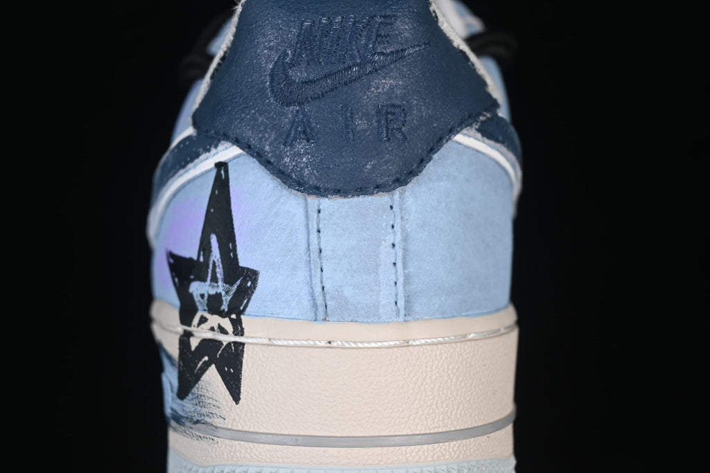 Rear close-up showing a dark heel tab and black star graphic
