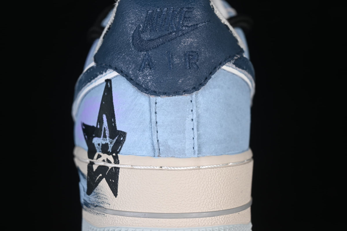 Rear close-up showing a dark heel tab and black star graphic