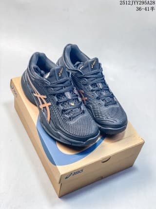 Pair of dark navy ASICS Sky Elite FF 3 sneakers with orange side branding displayed on an ASICS shoebox.