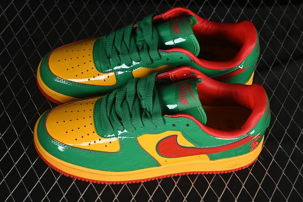 Pair of green, yellow, and red low-top sneakers shown from above and the side