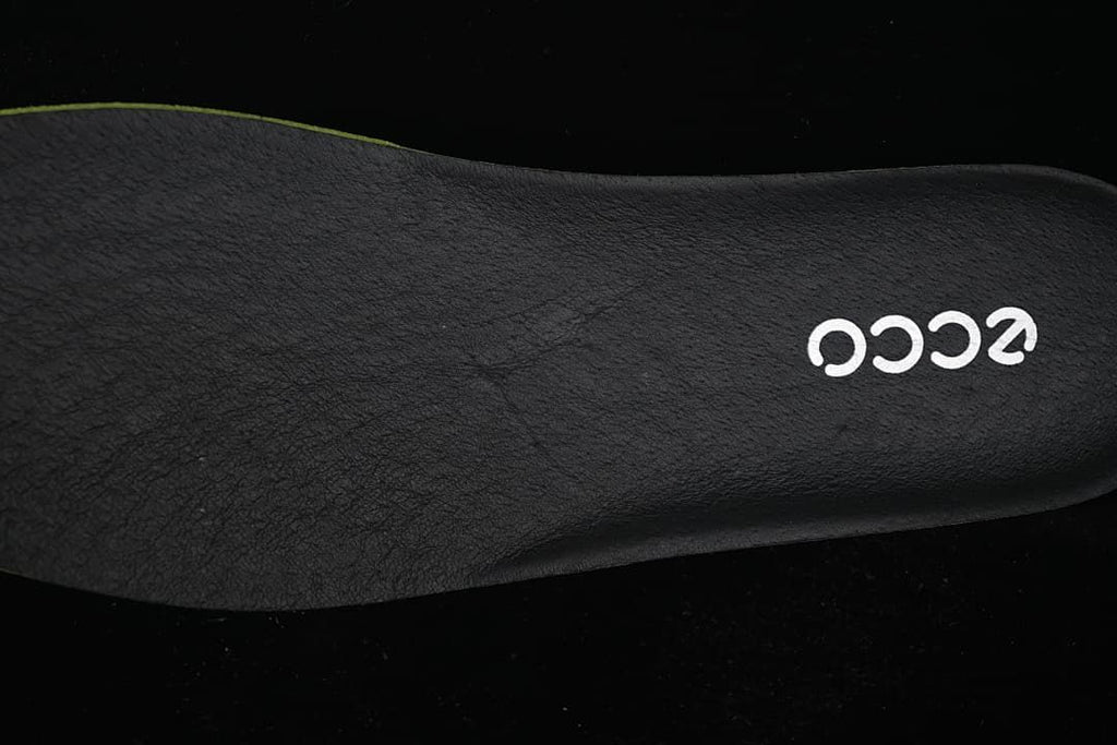 Close-up of a dark footbed with ECCO logo