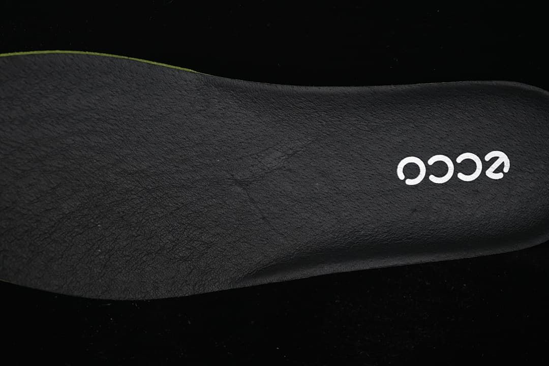 Close-up of a dark footbed with ECCO logo