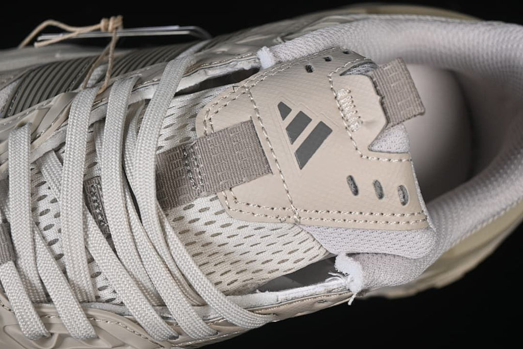 Close-up of the sneaker tongue, logo detail and laces