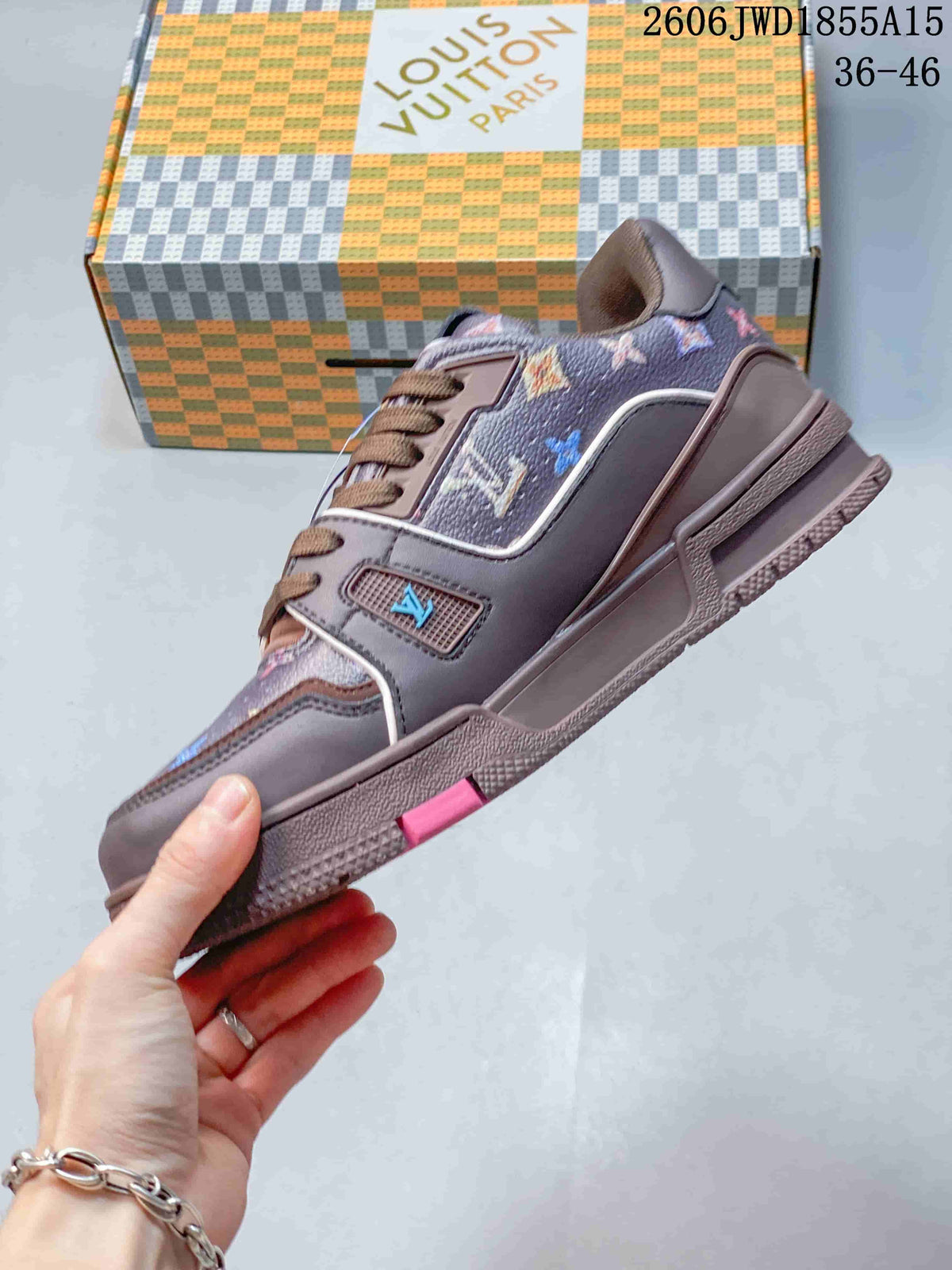 Side view of the low-top sneaker with multicolor patterned panels and a textured sole.