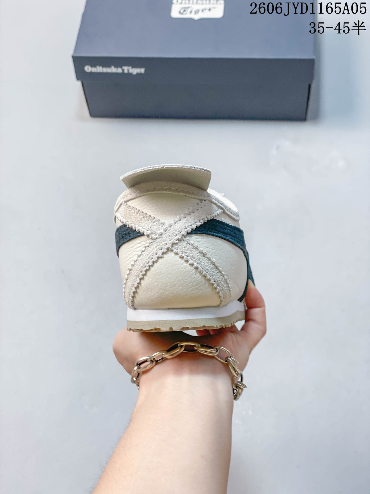 Rear view of an ivory-colored Onitsuka Tiger Mexico 66 sneaker with a dark navy stripe.