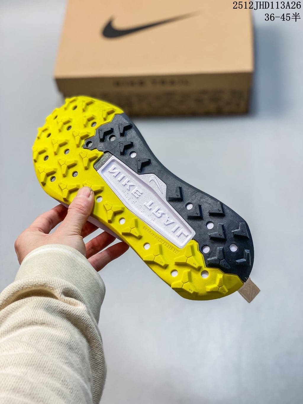 Close-up of the Nike Wildhorse trail shoe outsole showing yellow and dark lugged tread; image overlay states sizes 36–45.5.