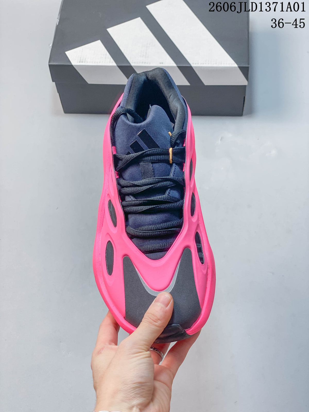 Top view of an Adidas Hyperboost sneaker with navy laces and pink side panels.