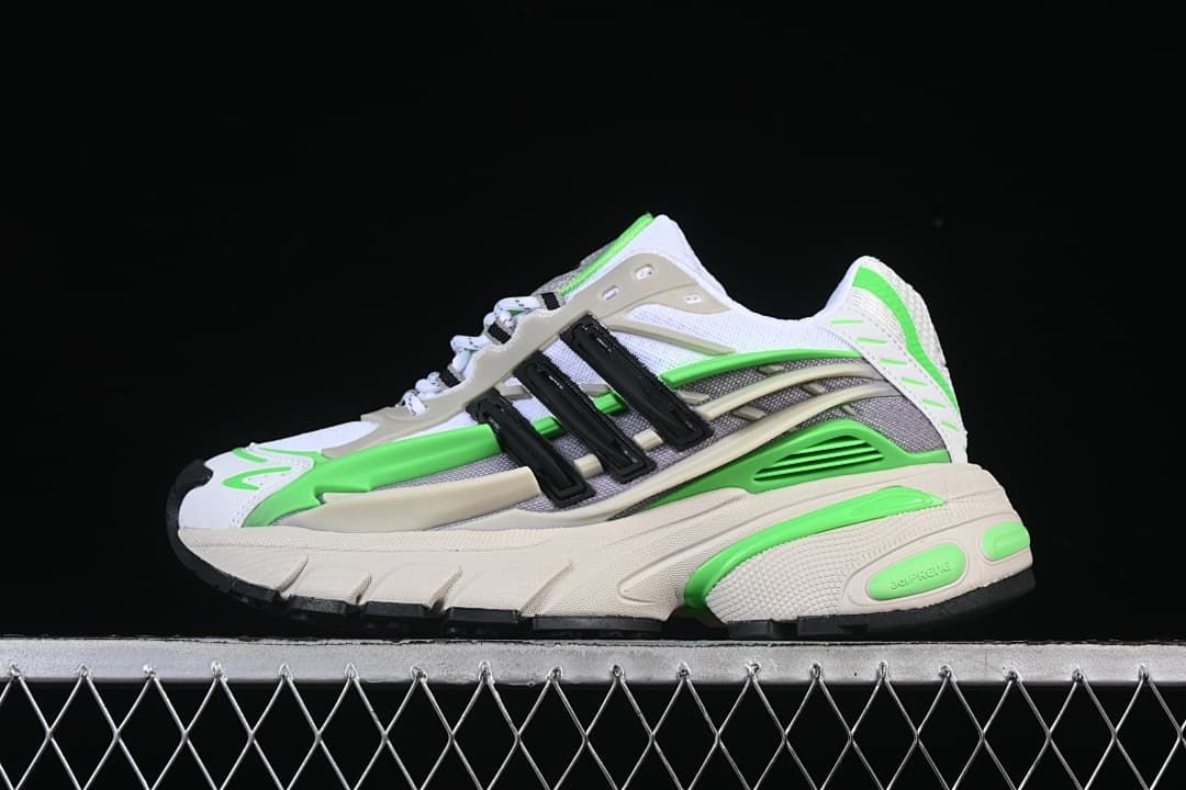 Side view of the Adidas Adistar Jellyfish sneaker in white, grey, cream, bright green, and black.