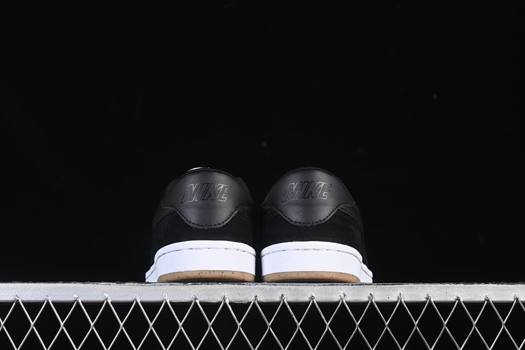 Rear view of the pair showing black heel panels and white midsoles.