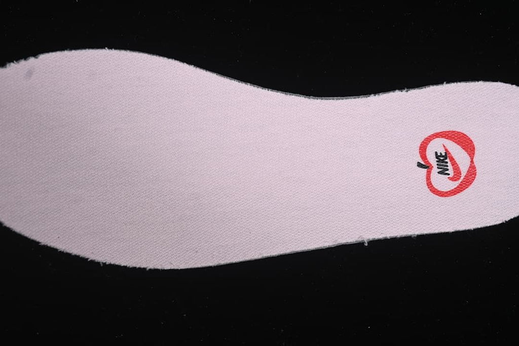Close-up of a pink insole with printed branding