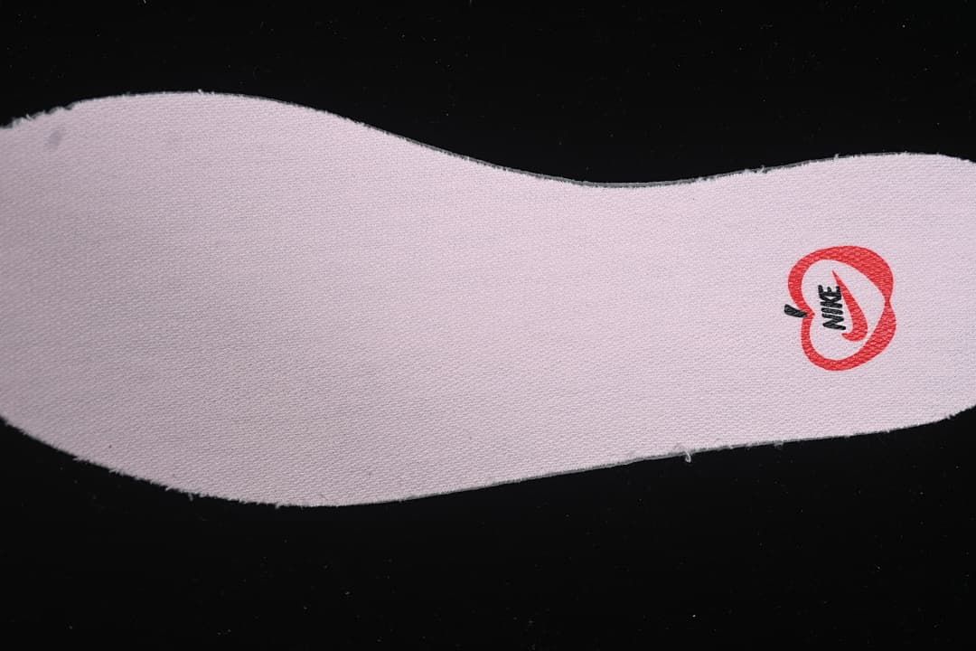 Close-up of a pink insole with printed branding