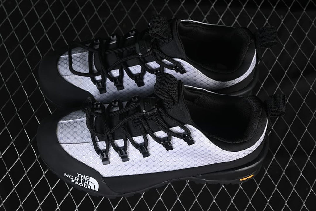 Pair of white and black Glenclyffe Low shoes viewed from above.