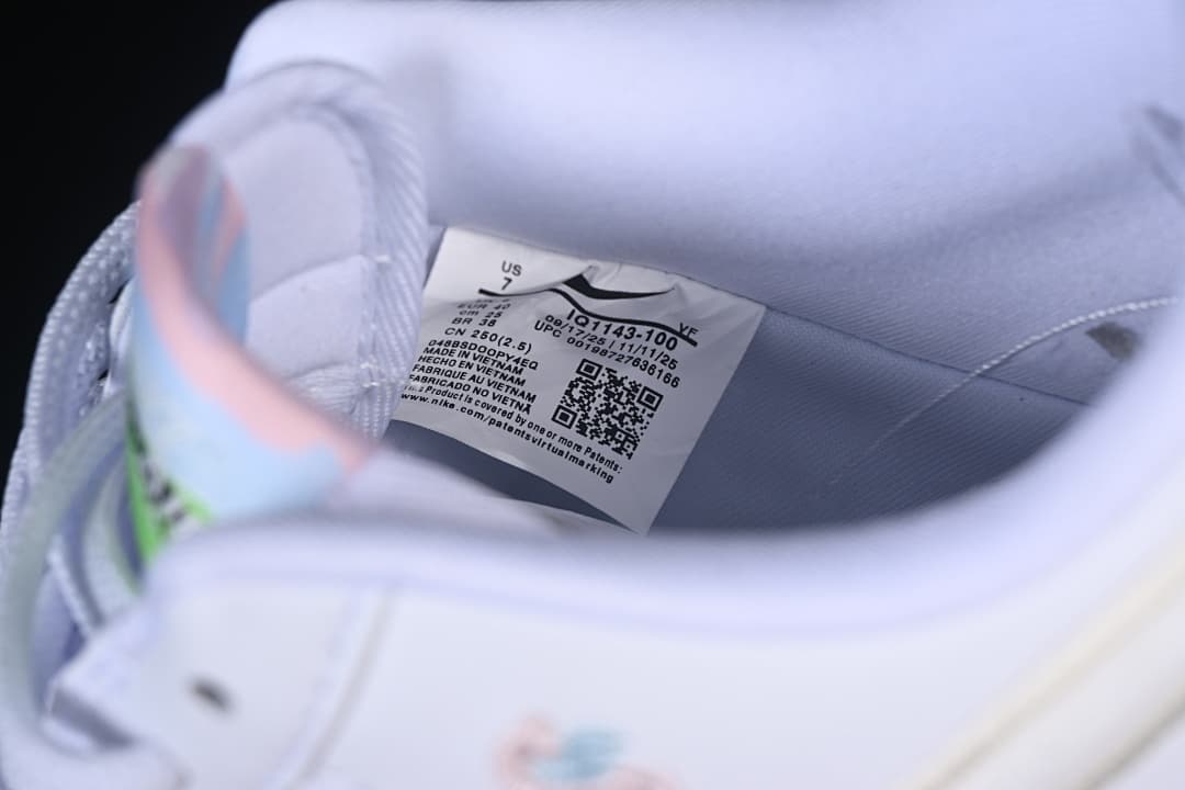 Interior shoe label showing product code IQ1143-100 and US size 7.