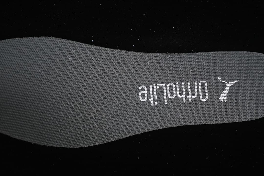 Close-up of the insole with Puma and The Open Product branding