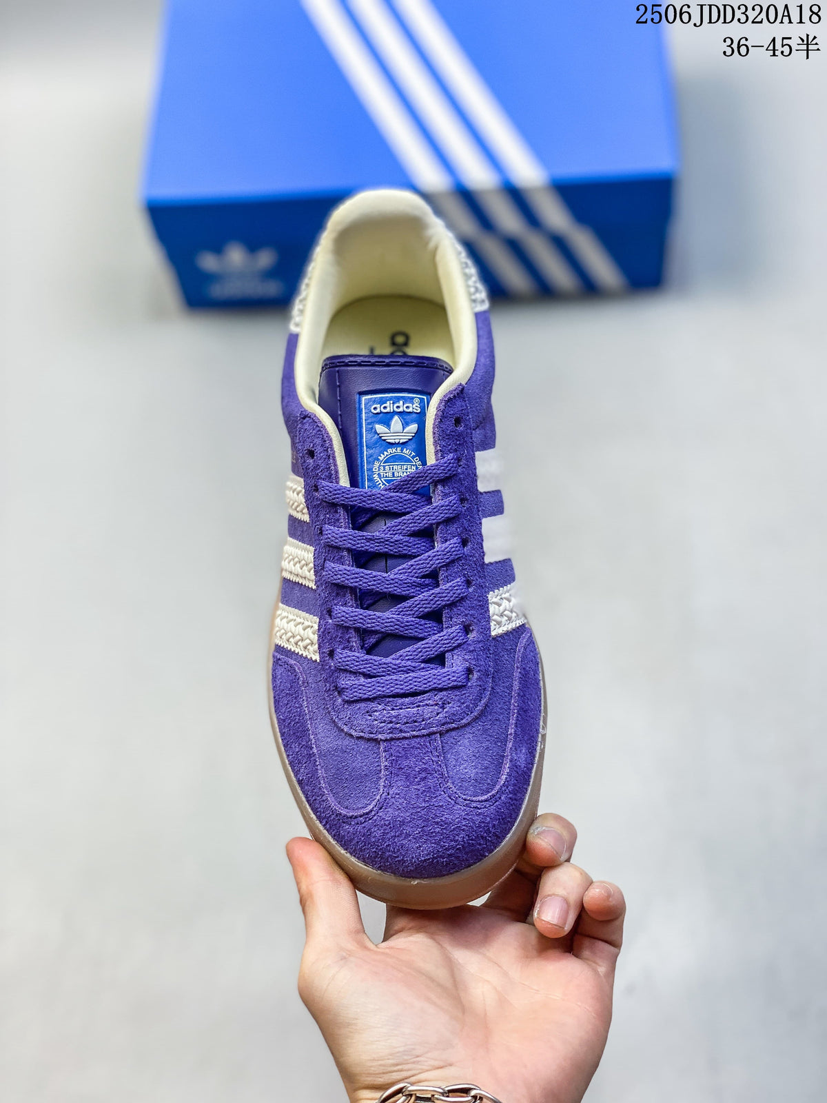 Front view of a purple Adidas Gazelle sneaker with matching laces