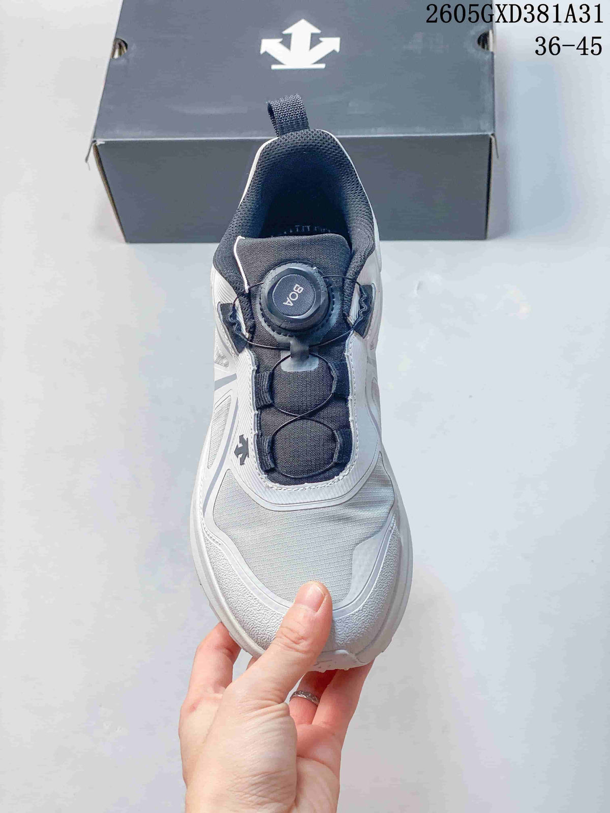 Top view of a Descente sneaker with a dial closure and dark tongue
