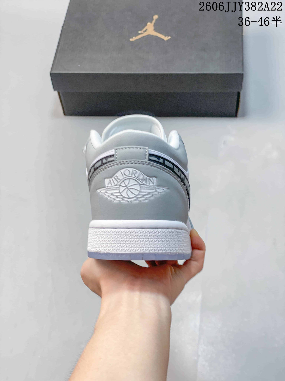 Rear view of the grey heel with Air Jordan Wings-style embossing