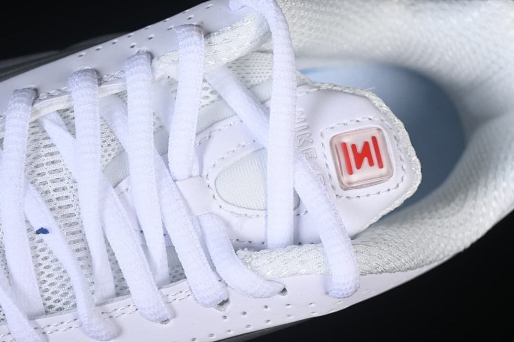 Close-up of the laces, tongue badge, and mesh sections