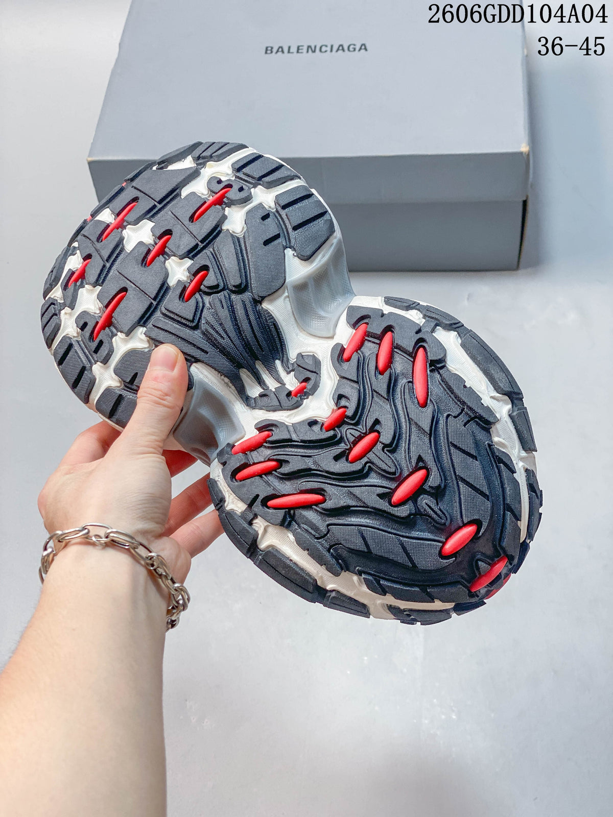 Close-up of the dark patterned outsole with red accents