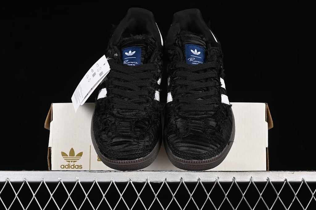 Front view of the pair showing textured black uppers and dark outsoles