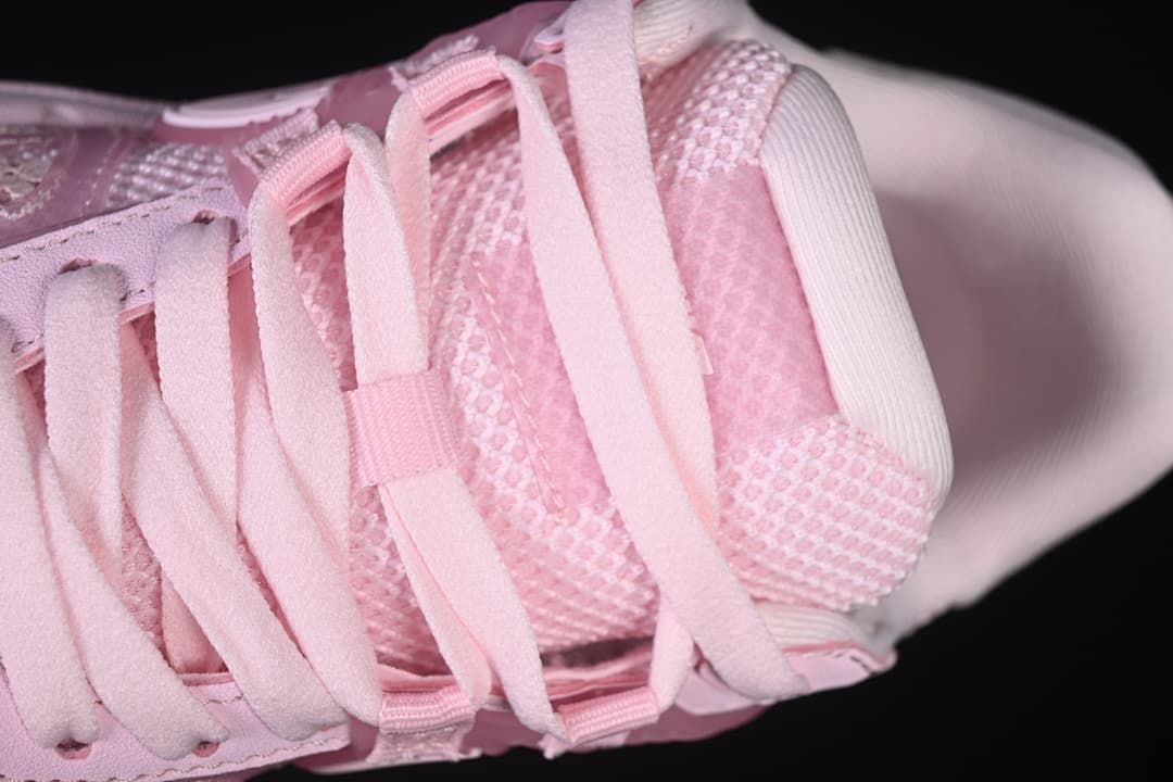 Top close-up of the pink laces and mesh tongue