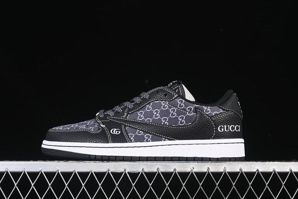 Side view of a black low-top sneaker with dark monogram-style panels and a white midsole