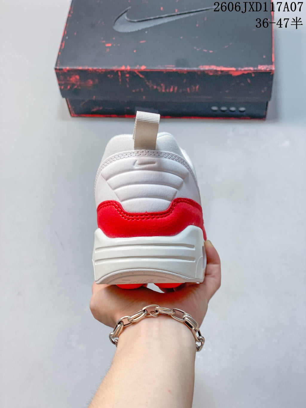 Rear view of the white and red Nike Air Max 1 sneaker