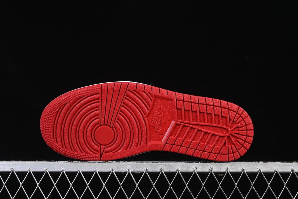 Red outsole with circular forefoot and tread pattern
