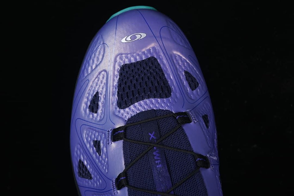Top view of the purple shoe showing its upper and lacing.