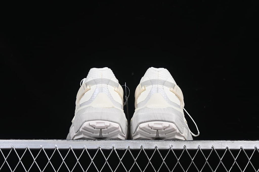 Rear view of both shoes showing the tread