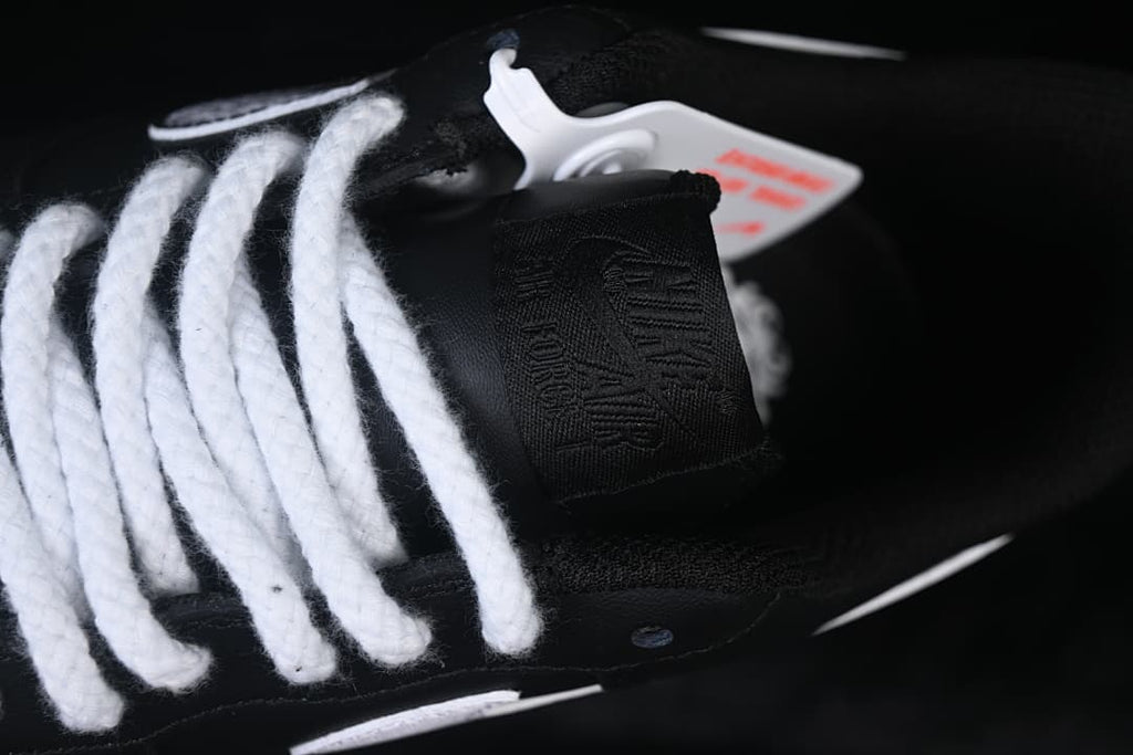 Close-up of the tongue and thick white laces