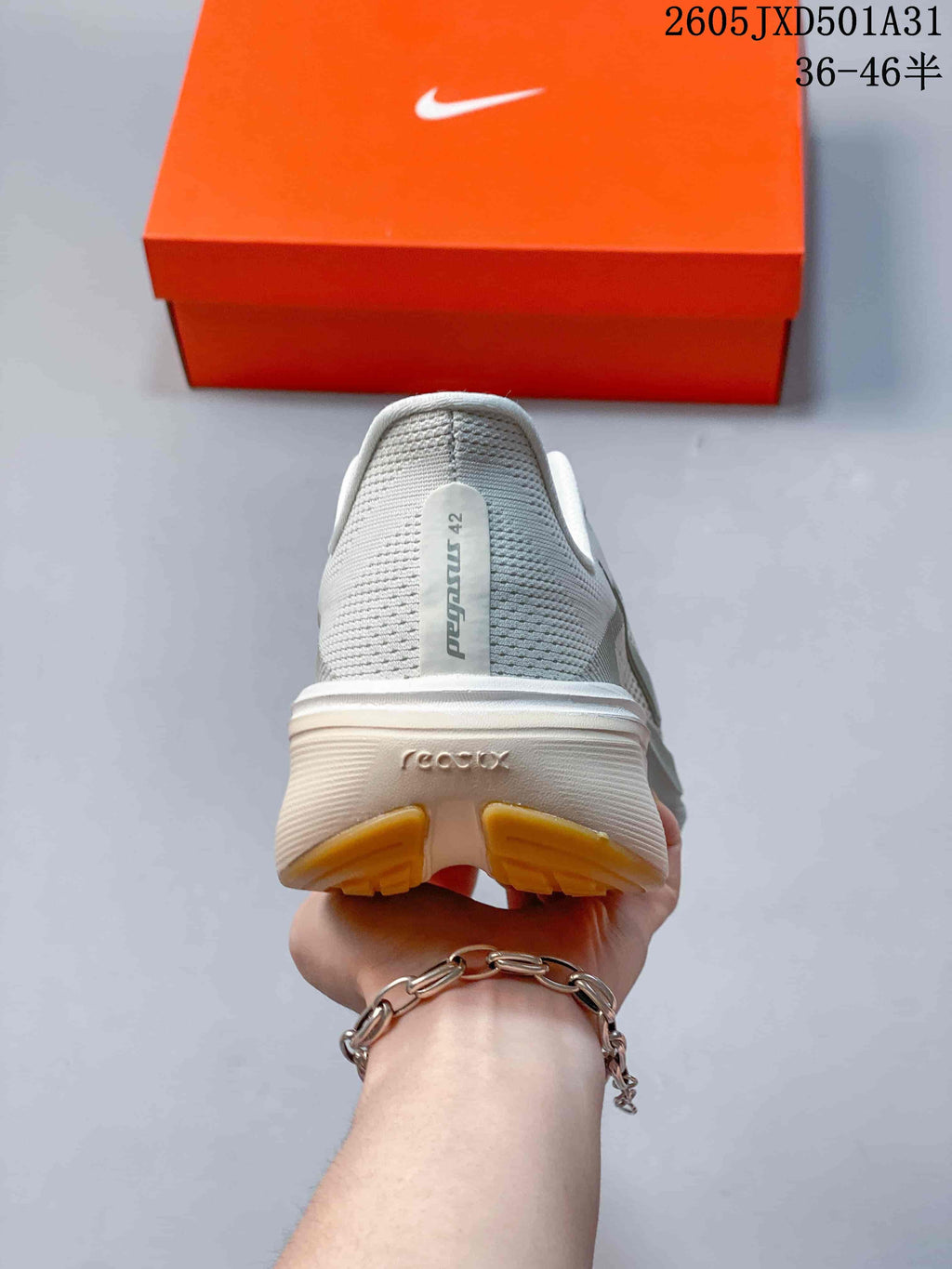 Rear view of the shoe showing the heel, midsole and gum-colored outsole