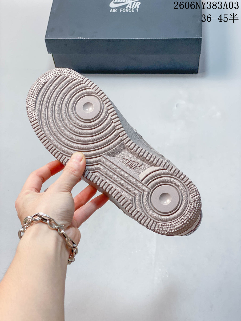 Close-up of the sneaker outsole showing circular traction patterns