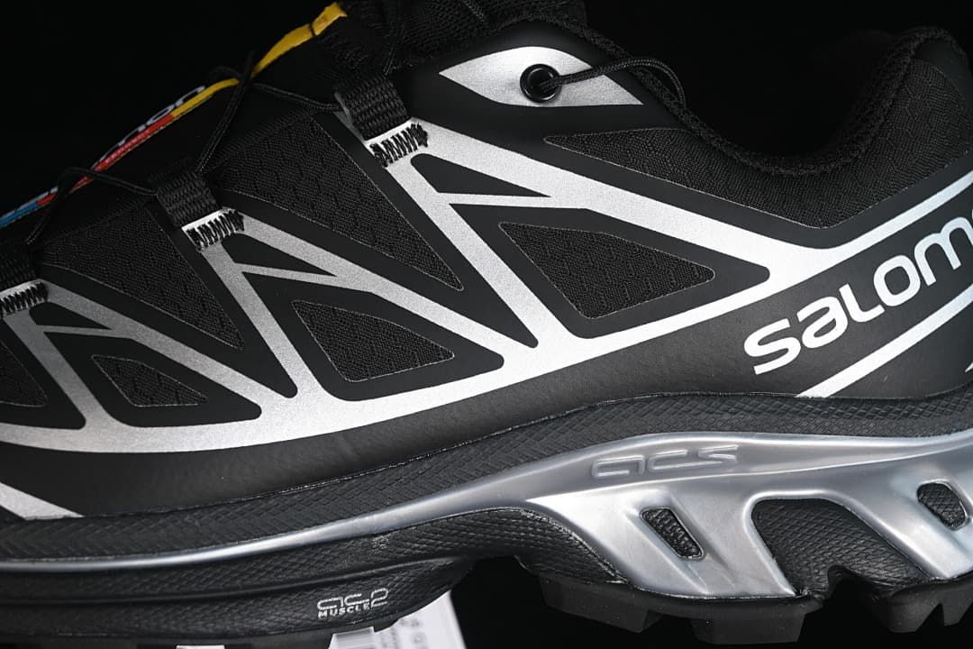 Close-up of the silver side structure, black upper, and lace system.