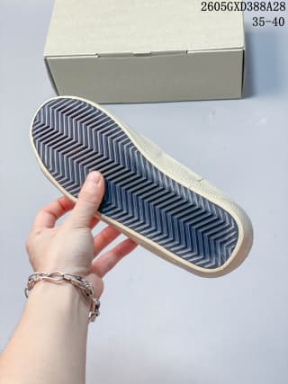 Underside of the sneaker showing its patterned outsole