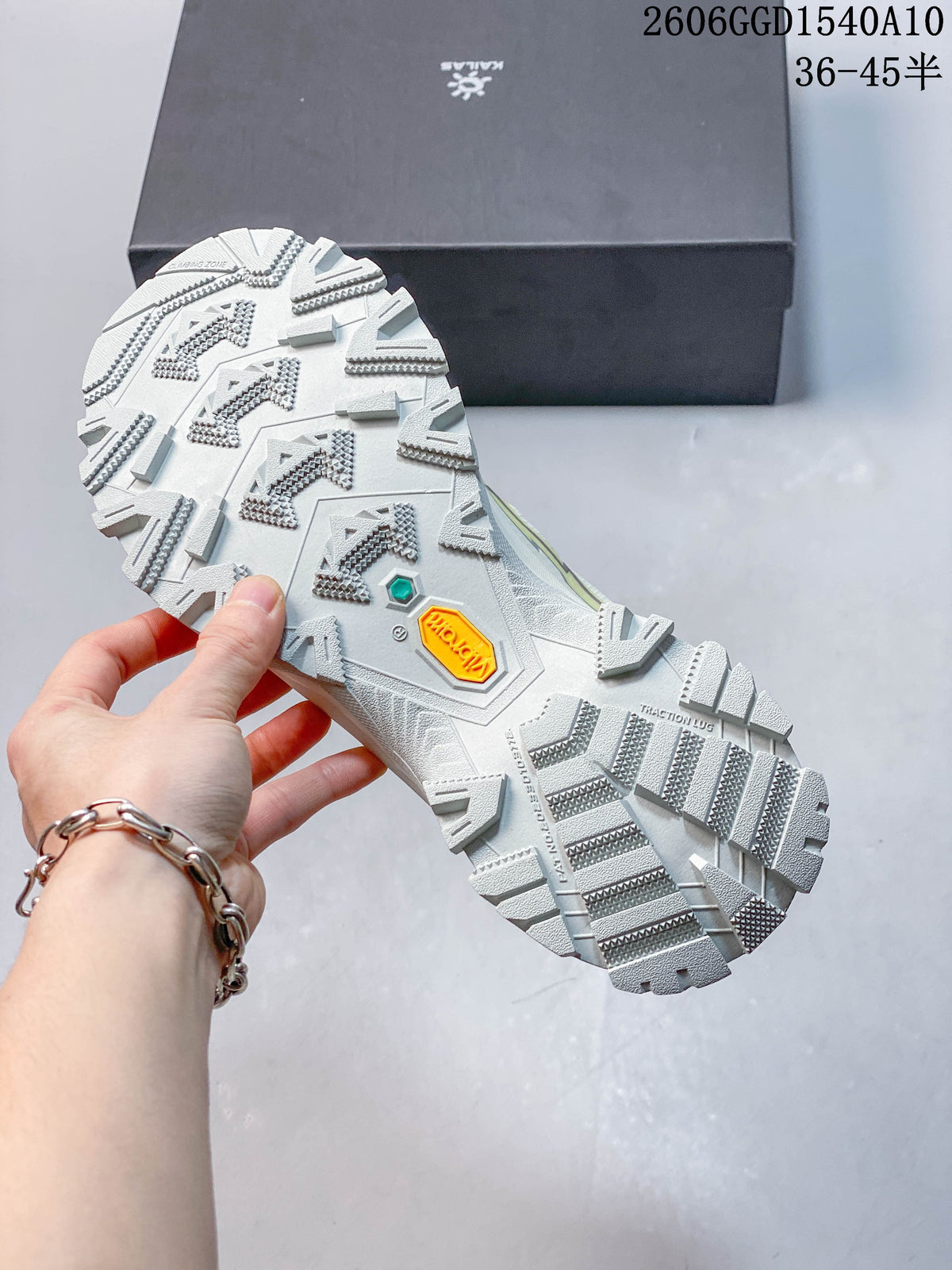 Close-up of the hiking shoe outsole, showing deep tread and a Vibram mark.